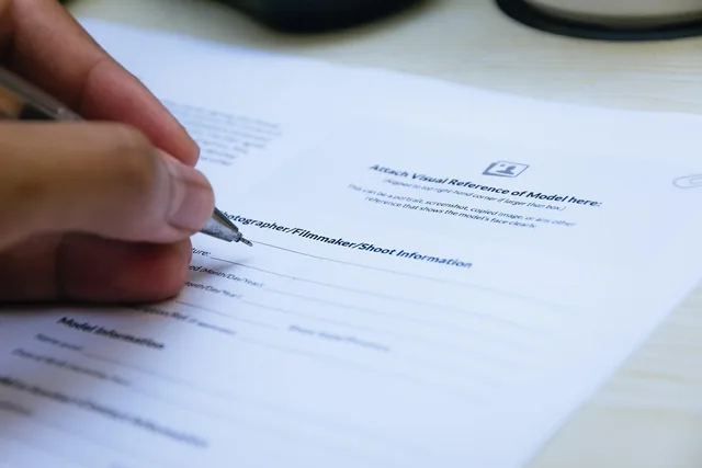signing, paper, hand, close up, document, writing, pen, office, business, agreement, contract, paper, agreement, agreement, agreement, contract, contract, contract, contract, contract. When to get creator contracts foundations right before launch