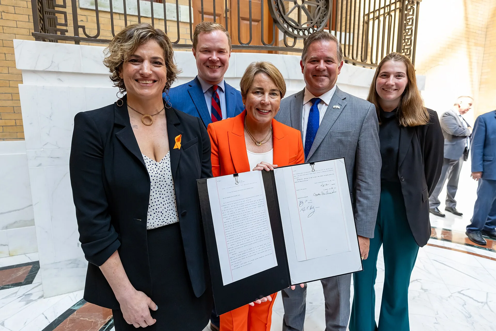 Governor Maura Healey and Secretary of Public Safety and Security Terrence Reidy join House Speaker Ronald Mariano, Senate President Karen Spilka, Joint Committee on the Judiciary Chair Rep. Michael Day, Sen. Cynthia Creem and Salisbury Police Chief Thomas Fowler, among other elected officials and a