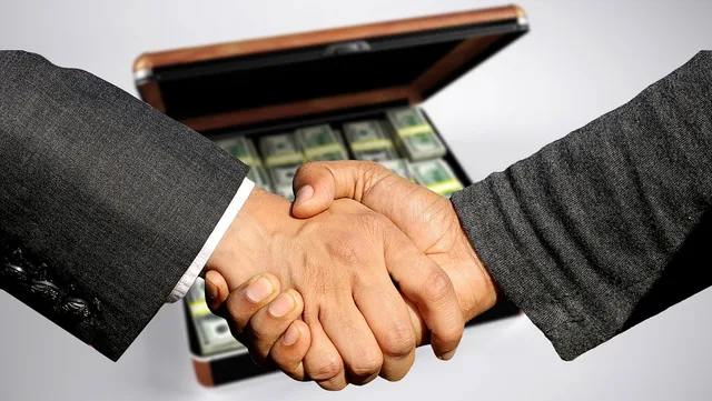 conclusion of contract, handshake, trade, business, profit, black money, control, treasury, sale, to buy, selling, commercial, shopping, money case, currency, money, contract, dollar, shaking hands, handshake, handshake, selling, selling, selling, selling, selling. Termination clause influencer agreement UK: drafting tips